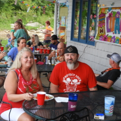 Man and Woman at Table Eating