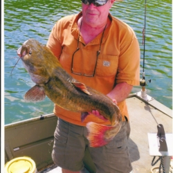 Man Holding Large Catfish