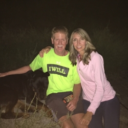 Man and Woman Smiling with Dog