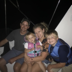 Family on Boat at Night