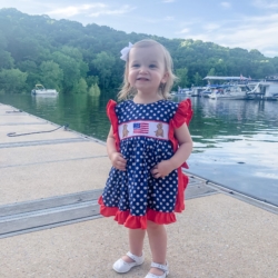 Little Girl Smiling by Water